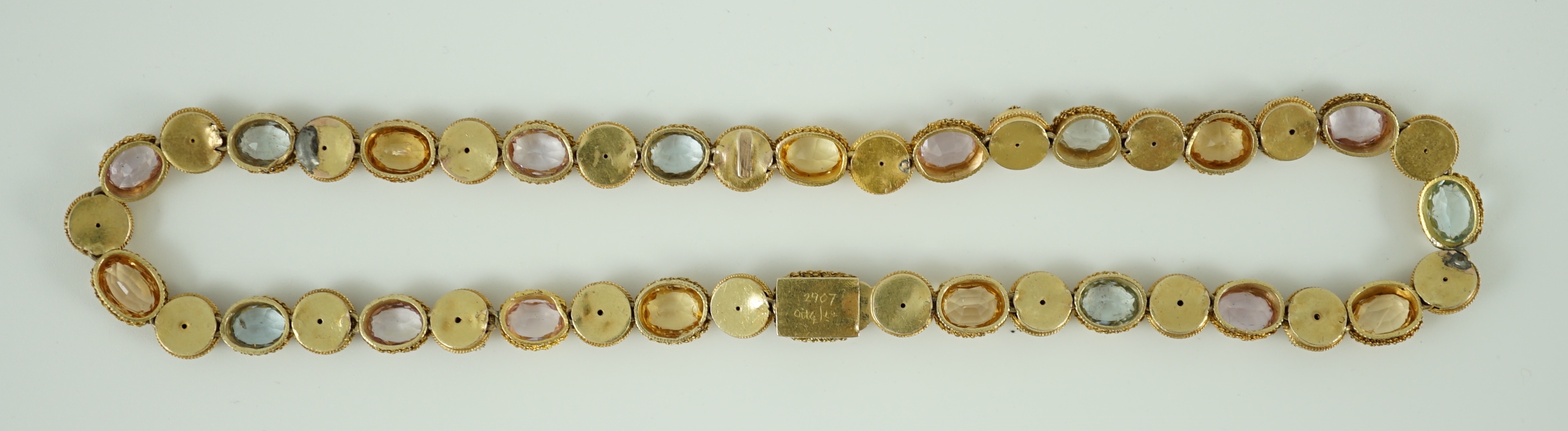 A 19th century gold, pink topaz, seed pearl, citrine and aquamarine set choker necklace